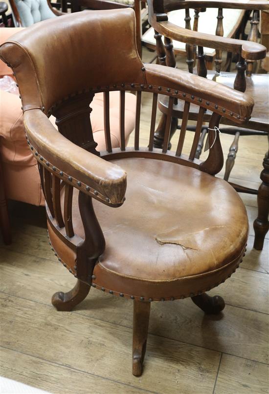 An Edwardian leather upholstered desk chair